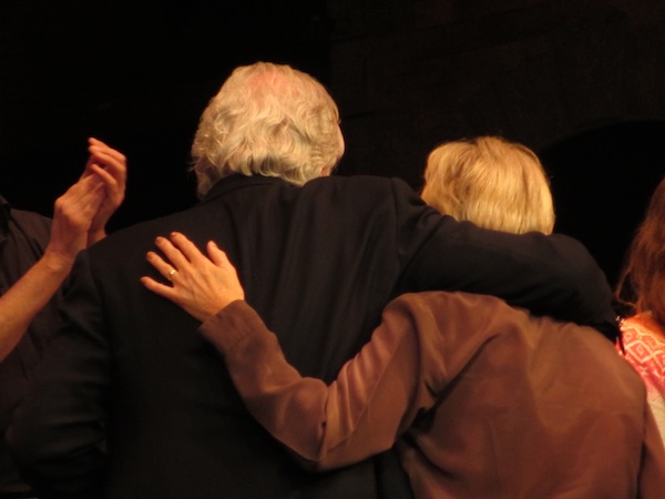 Bill Kenwright and Lyn Paul leave the stage with their arms around each other.